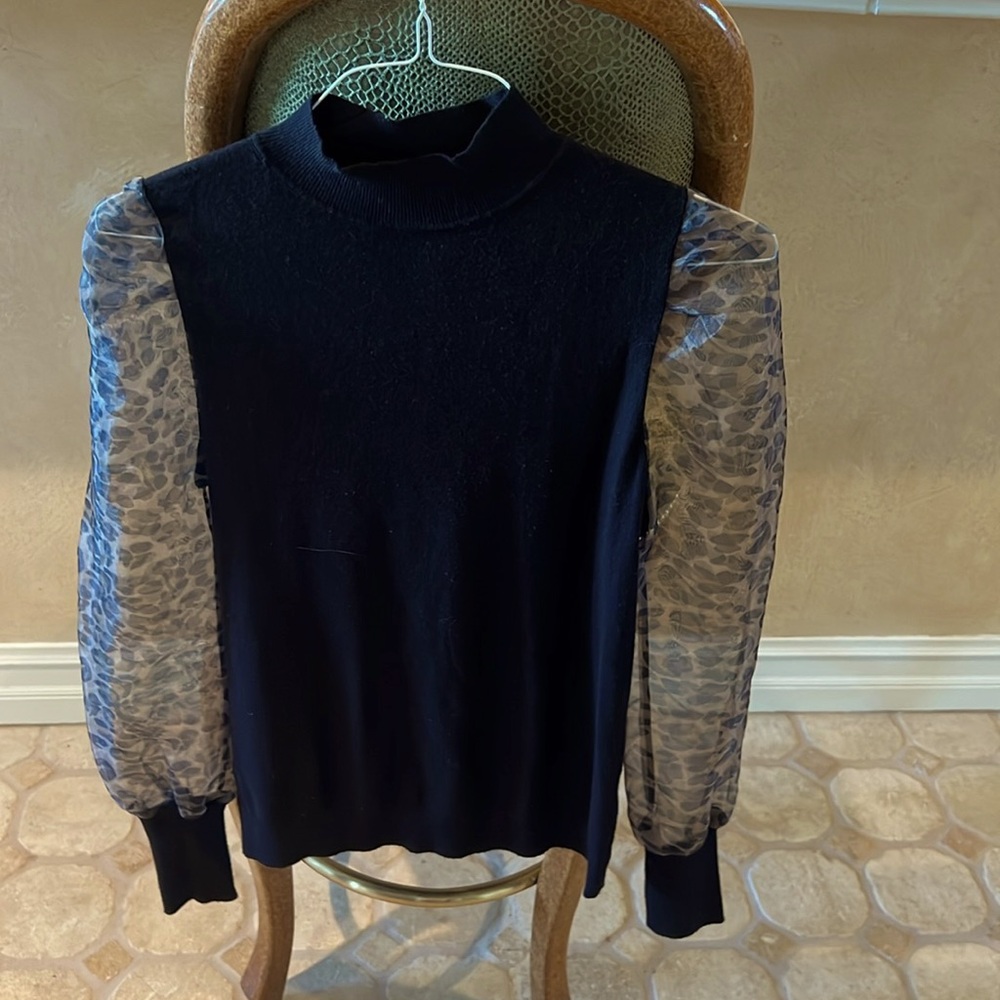Sioni black polyester top with animal print sleeves gently used
